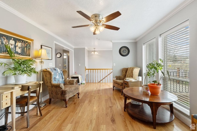 24725 N 11925 E, Fairview, UT 84629 - sitting room featuring an upstairs landing, healthy amount of natural light, light wood-style flooring, a ceiling fan, and ornamental molding