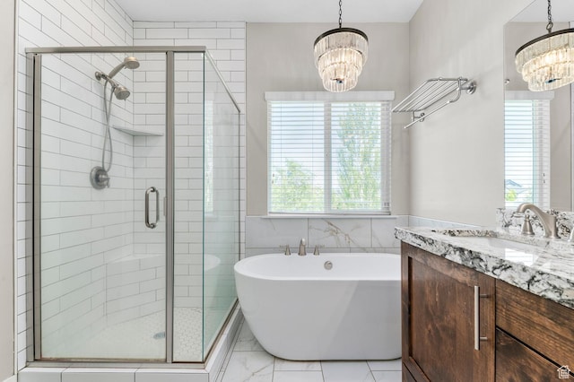 13703 S Blayde Dr, Herriman, UT 84096 - full bathroom with a chandelier, a soaking tub, a stall shower, and vanity