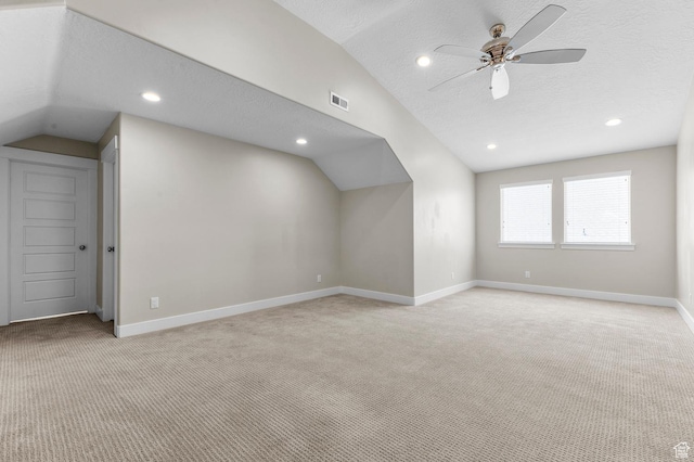 13703 S Blayde Dr, Herriman, UT 84096 - additional living space featuring lofted ceiling, light carpet, a ceiling fan, recessed lighting, and a textured ceiling
