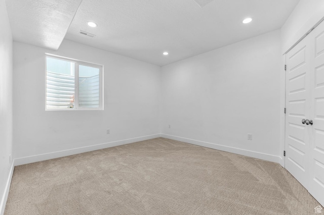 13703 S Blayde Dr, Herriman, UT 84096 - unfurnished room featuring light colored carpet, recessed lighting, and a textured ceiling
