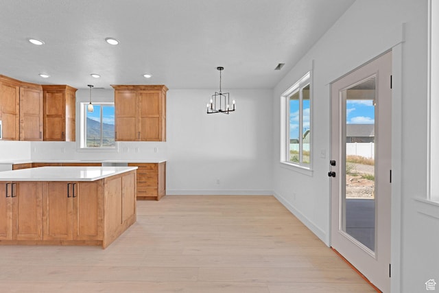 496 S 30 E, Franklin, ID 83237 - kitchen with light countertops, healthy amount of natural light, recessed lighting, light wood-style flooring, and a chandelier