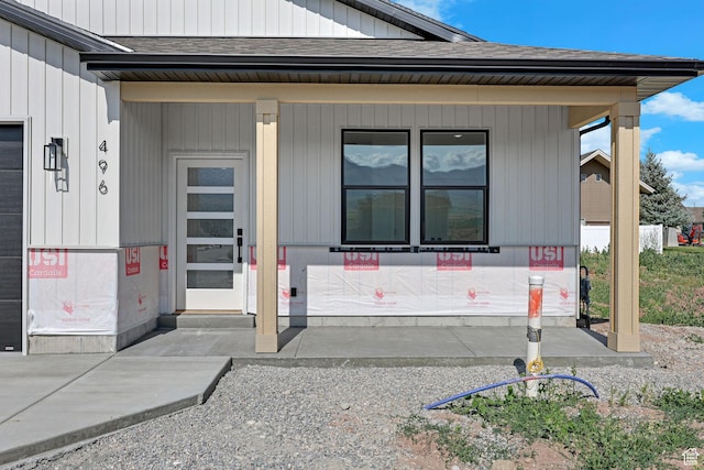 496 S 30 E, Franklin, ID 83237 - entrance to property with a shingled roof and a porch