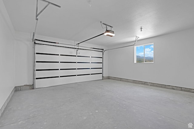 496 S 30 E, Franklin, ID 83237 - garage featuring a garage door opener and baseboards