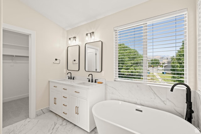 4012 N Bounty Cv W, Lehi, UT 84043 - full bath featuring marble look tile flooring, a freestanding bath, double vanity, and a spacious closet