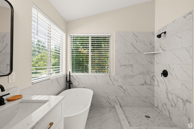 4012 N Bounty Cv W, Lehi, UT 84043 - full bath featuring marble look tile flooring, vanity, a freestanding tub, a tile shower, and vaulted ceiling