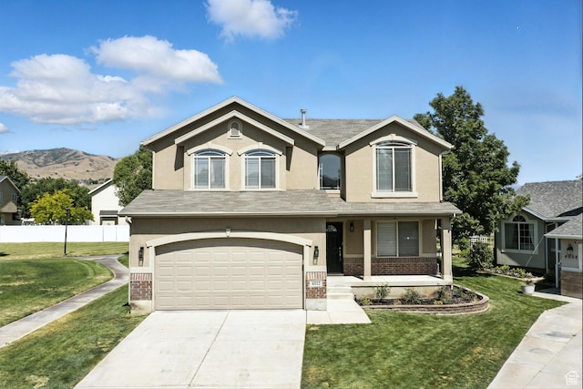 4012 N Bounty Cv W, Lehi, UT 84043 - view of front facade with brick siding, a garage, concrete driveway, and stucco siding