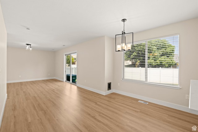 4012 N Bounty Cv W, Lehi, UT 84043 - empty room with a chandelier and light wood-type flooring