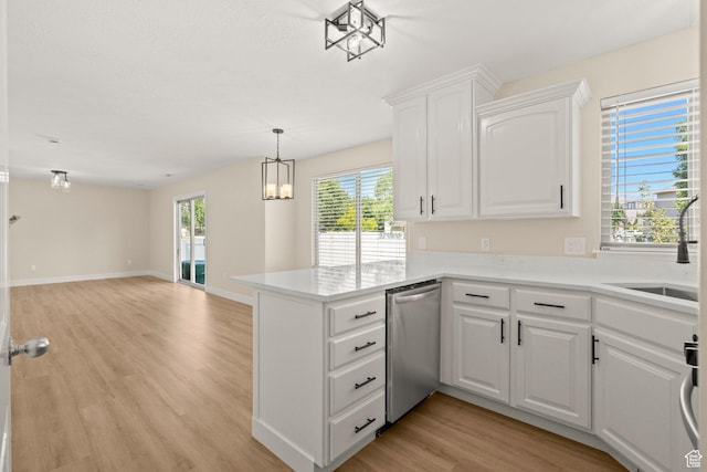 4012 N Bounty Cv W, Lehi, UT 84043 - kitchen featuring dishwasher, a peninsula, light wood-style floors, and healthy amount of natural light