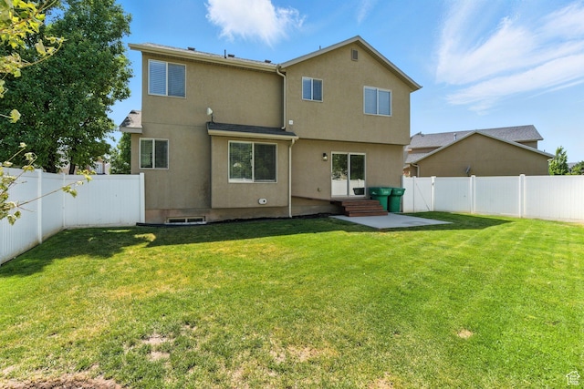 4012 N Bounty Cv W, Lehi, UT 84043 - rear view of property featuring a fenced backyard, stucco siding, and entry steps