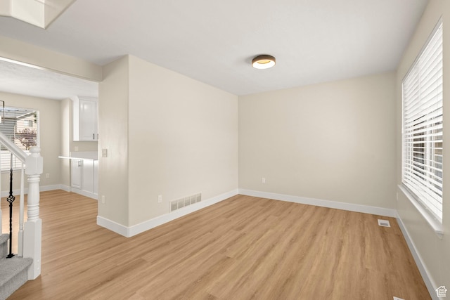 4012 N Bounty Cv W, Lehi, UT 84043 - spare room with light wood finished floors and stairs