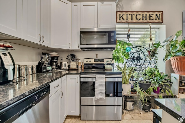 3981 S 500 E, Millcreek, UT 84107 - kitchen featuring stainless steel appliances, white cabinets, and dark stone counters