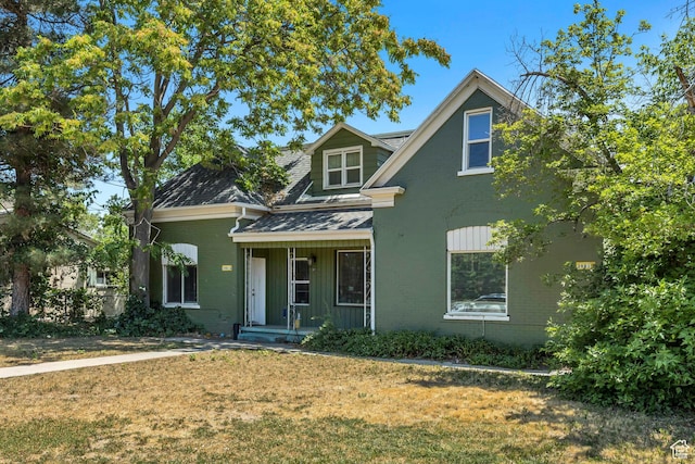 3981 S 500 E, Millcreek, UT 84107 - view of front facade with a porch, a front yard, and roof with shingles