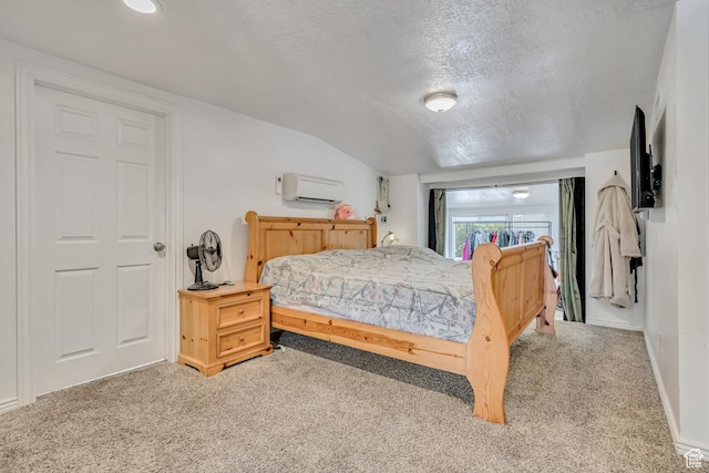 3981 S 500 E, Millcreek, UT 84107 - carpeted bedroom featuring a wall mounted air conditioner, a textured ceiling, and vaulted ceiling