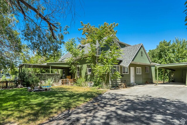 3981 S 500 E, Millcreek, UT 84107 - view of front of house featuring asphalt driveway, a shingled roof, and an attached carport