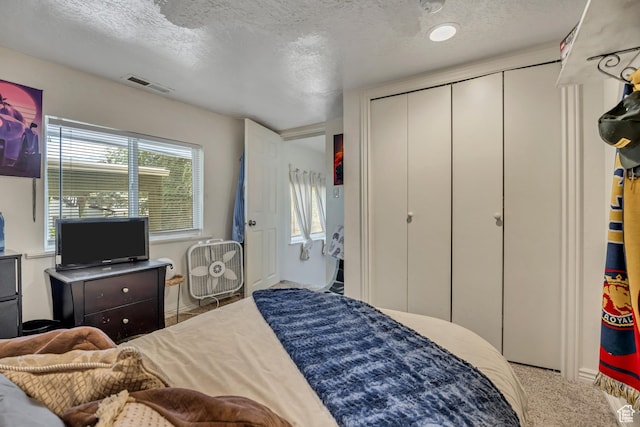 3981 S 500 E, Millcreek, UT 84107 - carpeted bedroom featuring a textured ceiling and a closet