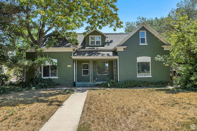 3981 S 500 E, Millcreek, UT 84107 - view of front of home featuring covered porch, a shingled roof, and a front lawn