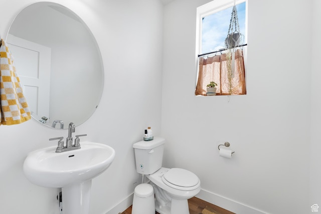 4925 E Breezy Patch Rd, Eagle Mountain, UT 84005 - half bath featuring baseboards and wood finished floors