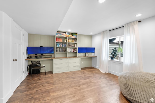 4925 E Breezy Patch Rd, Eagle Mountain, UT 84005 - home office featuring built in study area, wood finished floors, and recessed lighting