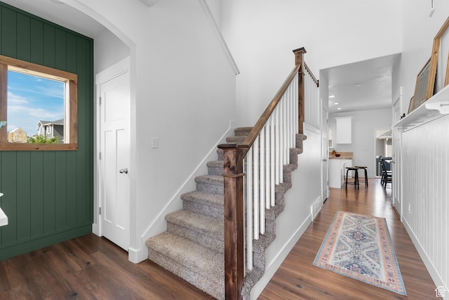 4925 E Breezy Patch Rd, Eagle Mountain, UT 84005 - staircase featuring wood finished floors and arched walkways