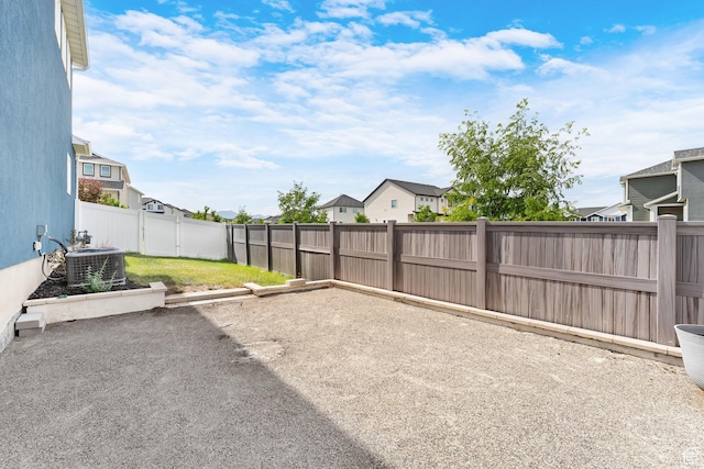 4925 E Breezy Patch Rd, Eagle Mountain, UT 84005 - fenced backyard with a residential view and a patio