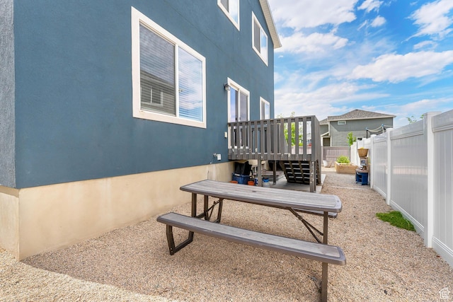 4925 E Breezy Patch Rd, Eagle Mountain, UT 84005 - fenced backyard with a deck