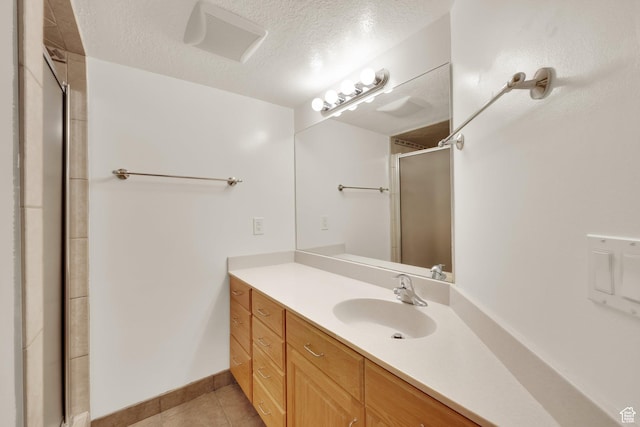 1604 W Roenewood Cir S, Taylorsville, UT 84123 - full bath with tile patterned floors, a stall shower, vanity, and a textured ceiling