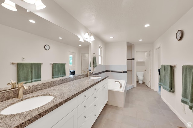 1604 W Roenewood Cir S, Taylorsville, UT 84123 - full bath with double vanity, a garden tub, recessed lighting, and tile patterned flooring