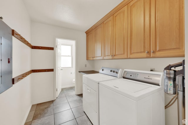 1604 W Roenewood Cir S, Taylorsville, UT 84123 - laundry room featuring cabinet space, washer and dryer, and light tile patterned floors