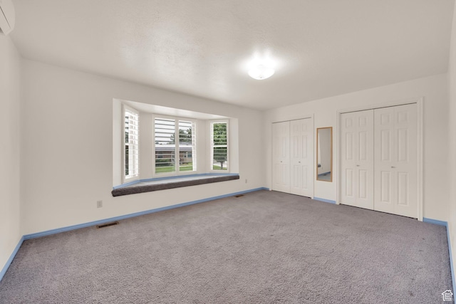 1604 W Roenewood Cir S, Taylorsville, UT 84123 - unfurnished bedroom featuring multiple closets and carpet flooring