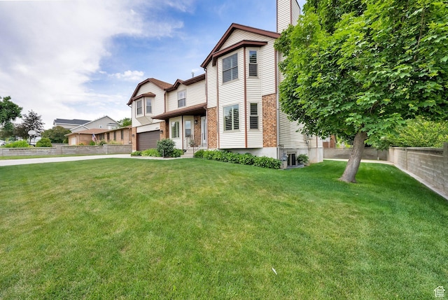 1604 W Roenewood Cir S, Taylorsville, UT 84123 - view of front of property with a front lawn, an attached garage, a chimney, driveway, and brick siding