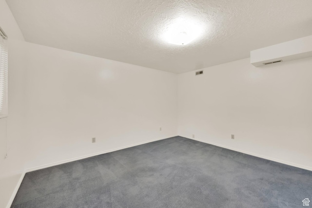 1604 W Roenewood Cir S, Taylorsville, UT 84123 - unfurnished room featuring dark colored carpet and a textured ceiling
