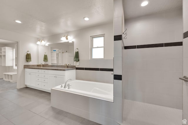 1604 W Roenewood Cir S, Taylorsville, UT 84123 - full bathroom with a garden tub, double vanity, tile patterned floors, walk in shower, and recessed lighting