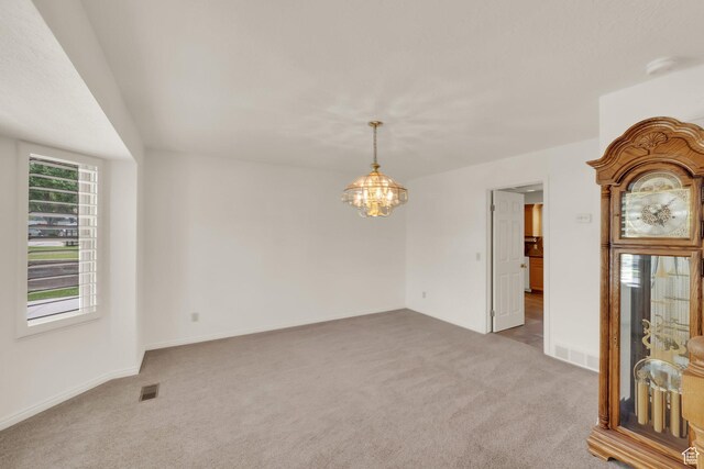 1604 W Roenewood Cir S, Taylorsville, UT 84123 - unfurnished room featuring carpet floors, a chandelier, and a smoke detector