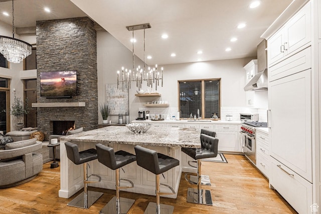 6423 Golden Bear Loop Unit 5, Park City, UT 84098 - kitchen featuring a chandelier, a center island, high end stainless steel range, light wood-style flooring, and recessed lighting