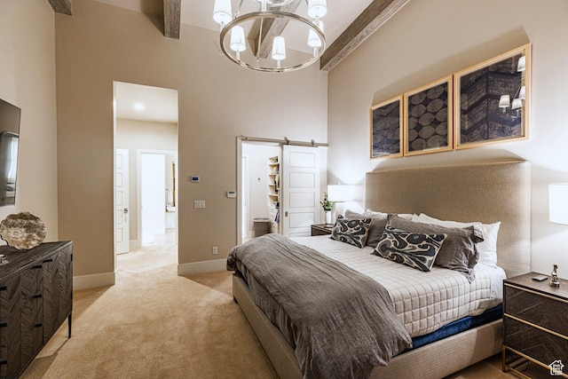 6423 Golden Bear Loop Unit 5, Park City, UT 84098 - bedroom with a towering ceiling, carpet flooring, a barn door, a chandelier, and beam ceiling