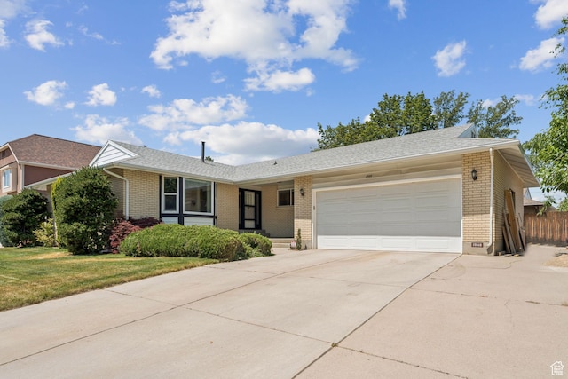 10148 S Roseboro Rd, Sandy, UT 84092 - ranch-style house featuring brick siding, a garage, and driveway