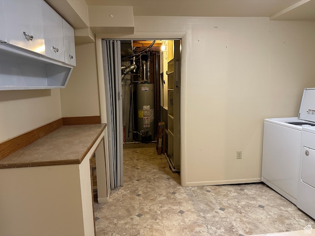 487 Highland Blvd, Brigham City, UT 84302 - laundry area featuring washer and clothes dryer, gas water heater, and cabinet space