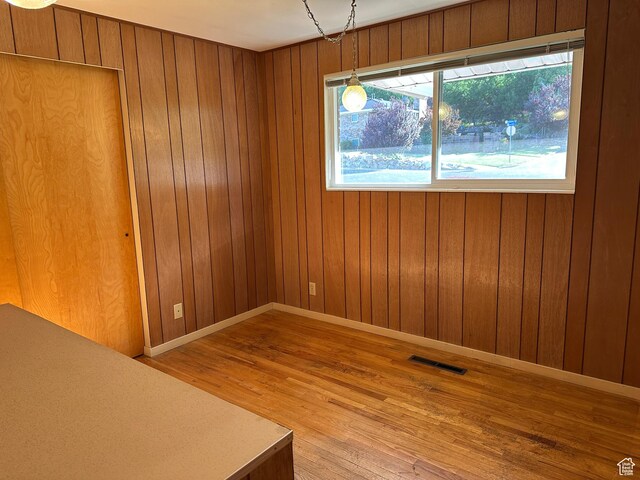 487 Highland Blvd, Brigham City, UT 84302 - empty room with light wood-style floors and wood walls