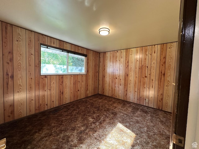 487 Highland Blvd, Brigham City, UT 84302 - unfurnished room with carpet floors and wooden walls