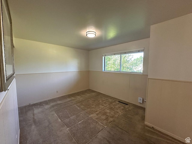 487 Highland Blvd, Brigham City, UT 84302 - spare room with wainscoting and carpet floors