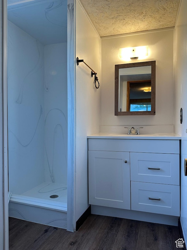 487 Highland Blvd, Brigham City, UT 84302 - bathroom with wood finished floors, vanity, and a stall shower