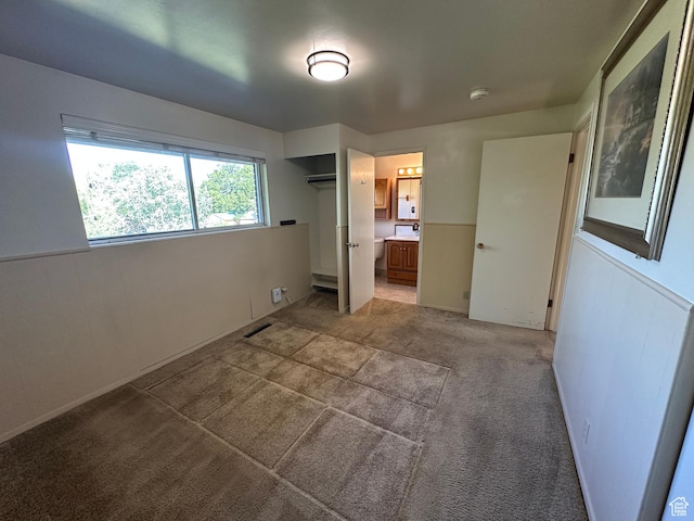487 Highland Blvd, Brigham City, UT 84302 - unfurnished bedroom with light carpet and connected bathroom