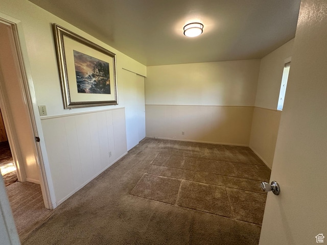 487 Highland Blvd, Brigham City, UT 84302 - empty room featuring a wainscoted wall and carpet flooring