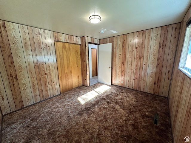 487 Highland Blvd, Brigham City, UT 84302 - unfurnished bedroom with carpet and wooden walls
