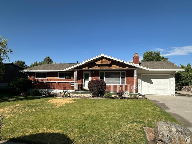 487 Highland Blvd, Brigham City, UT 84302 - single story home with an attached garage, driveway, brick siding, a chimney, and a front yard