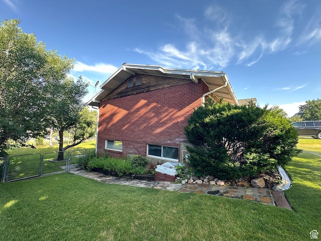 487 Highland Blvd, Brigham City, UT 84302 - view of home's exterior featuring brick siding and a gate