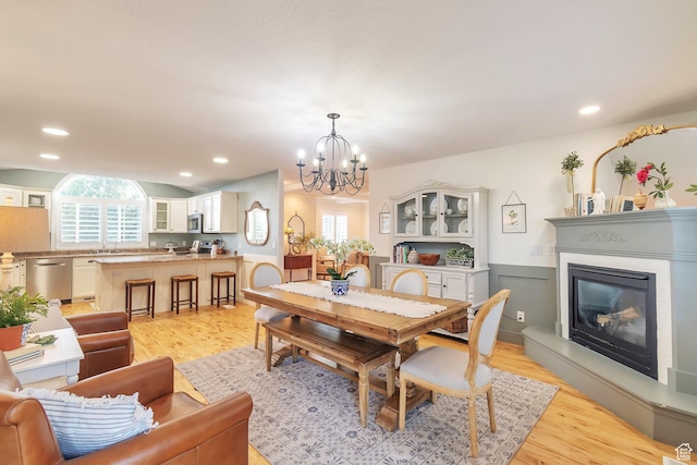 314 E 1290 S, Payson, UT 84651 - dining room with a chandelier, light wood-style floors, a glass covered fireplace, and recessed lighting