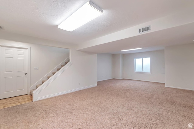 314 E 1290 S, Payson, UT 84651 - below grade area featuring light colored carpet, stairway, and a textured ceiling