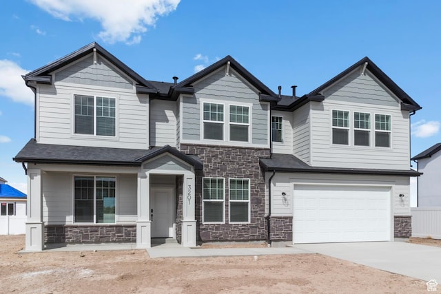 3460 W 3175 N # 343, Plain City, UT 84404 - craftsman-style house with stone siding, concrete driveway, an attached garage, and covered porch