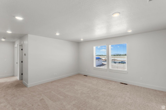 3460 W 3175 N # 343, Plain City, UT 84404 - spare room featuring light carpet, recessed lighting, and a textured ceiling